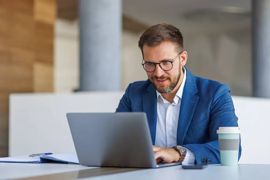 A business owner checking a website on a laptop